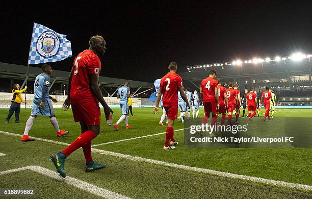 Mamadou Sakho of Liverpool follows his team mates onto the pitch for the start of the Manchester City v Liverpool Premier League 2 game at The...