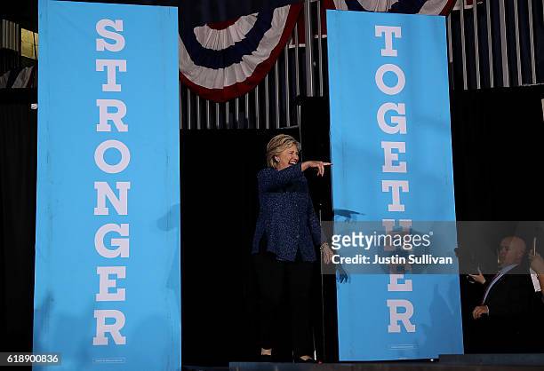 Democratic presidential nominee former Secretary of State Hillary Clinton greets supporters during a campaign rally at Roosevelt High School on...