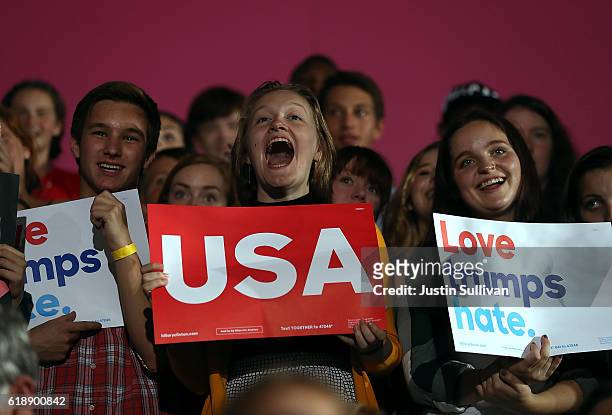 Supporters cheer as Democratic presidential nominee former Secretary of State Hillary Clinton speaks during a campaign rally at Roosevelt High School...