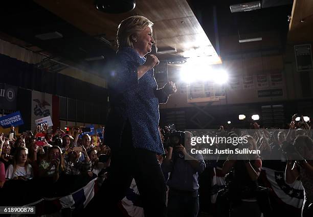 Democratic presidential nominee former Secretary of State Hillary Clinton greets supporters during a campaign rally at Roosevelt High School on...