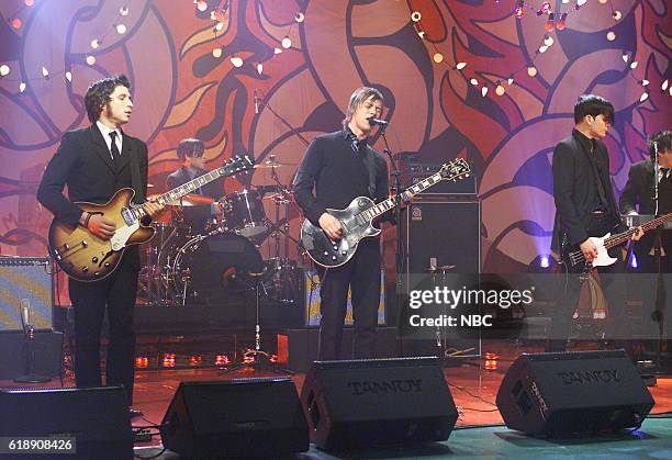 Episode 2435 -- Pictured: Musical guests Daniel Kessler, Sam Fogarino , Paul Banks, and Carlos Dengler of Interpol perform on February 20, 2003 --