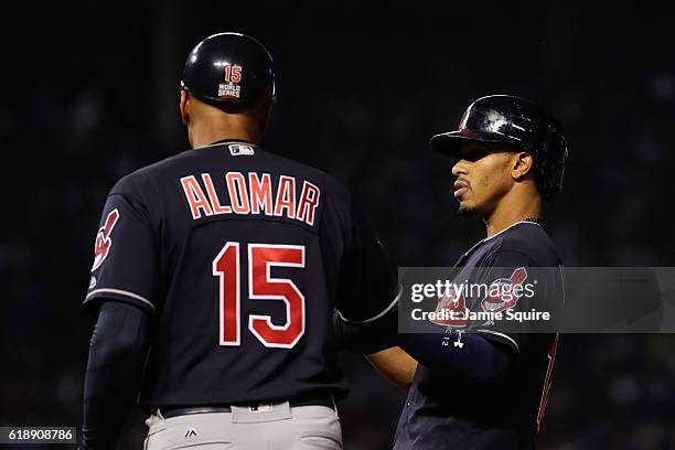 Francisco Lindor of the Cleveland Indians is congratulated by first base coach Sandy Alomar Jr. After hitting a single in the first inning against...