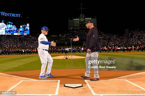 Managers Joe Maddon of the Chicago Cubs and Terry Francona of the Cleveland Indians shake hands during player introductions prior to Game 3 of the...