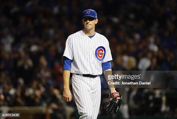 Kyle Hendricks of the Chicago Cubs walks off the mound after being relieved in the fifth inning against the Cleveland Indians in Game Three of the...