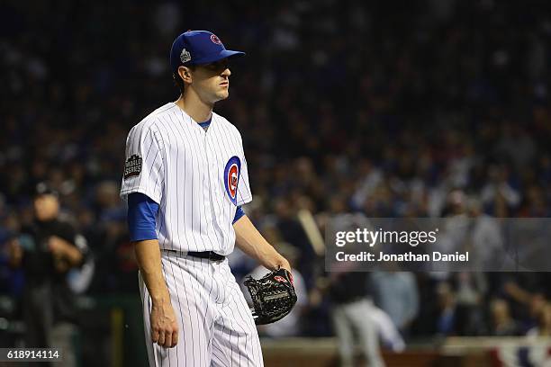 Kyle Hendricks of the Chicago Cubs reacts after giving up a walk in the fifth inning against the Cleveland Indians in Game Three of the 2016 World...