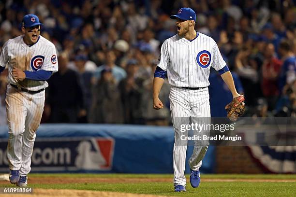 Justin Grimm and Anthony Rizzo of the Chicago Cubs react to an inning ending double play in the fifth inning during Game 3 of the 2016 World Series...