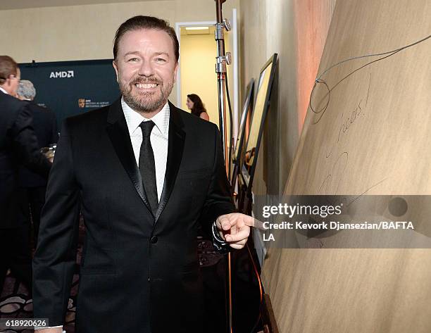 Honoree Ricky Gervais autographs memorabilia during the 2016 AMD British Academy Britannia Awards presented by Jaguar Land Rover and American...