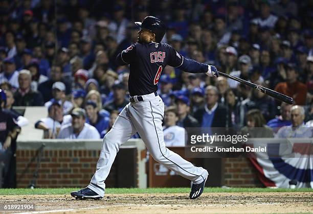 Coco Crisp of the Cleveland Indians hits a single in the seventh inning against the Chicago Cubs in Game Three of the 2016 World Series at Wrigley...