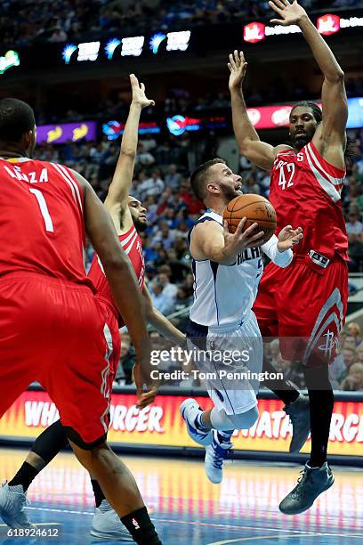 Barea of the Dallas Mavericks drives to the basket against Trevor Ariza of the Houston Rockets, Tyler Ennis of the Houston Rockets and Nene Hilario...