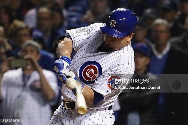 Kyle Schwarber of the Chicago Cubs breaks his bat on a pitch in the eighth inning against the Cleveland Indians in Game Three of the 2016 World...