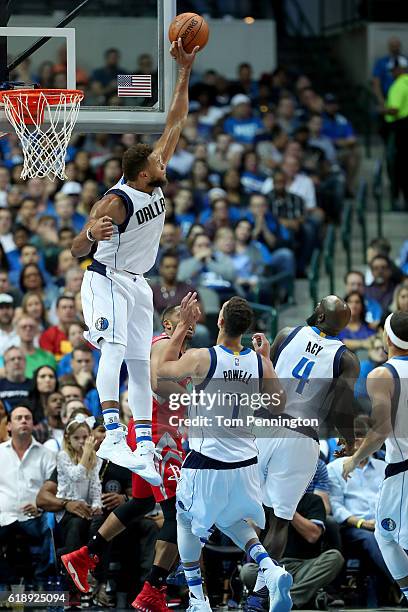 Justin Anderson of the Dallas Mavericks blocks a shot against Eric Gordon of the Houston Rockets in the second half at American Airlines Center on...