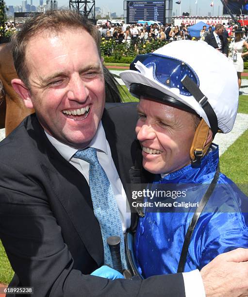 Kerrin McEvoy is congratulated by trainer Charlie Appleby after Oceanographer won Race 4, Lexus Stakes on Derby Day at Flemington Racecourse on...