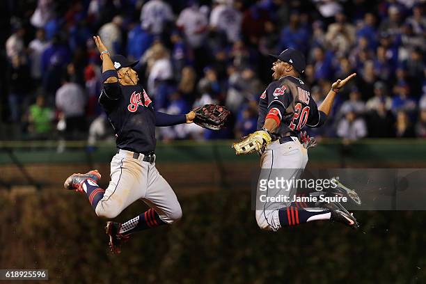 Francisco Lindor and Rajai Davis of the Cleveland Indians celebrate after defeating the Chicago Cubs 1-0 in Game Three of the 2016 World Series at...
