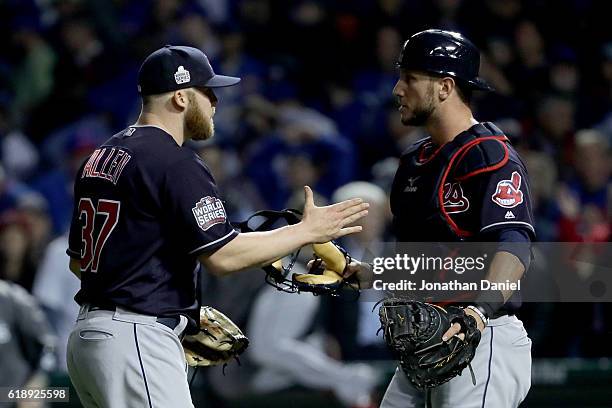 Cody Allen and Roberto Perez of the Cleveland Indians celebrate after beating the Chicago Cubs 1-0 in Game Three of the 2016 World Series at Wrigley...