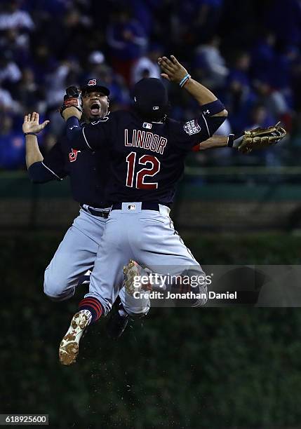 Francisco Lindor and Rajai Davis of the Cleveland Indians celebrate after defeating the Chicago Cubs 1-0 in Game Three of the 2016 World Series at...