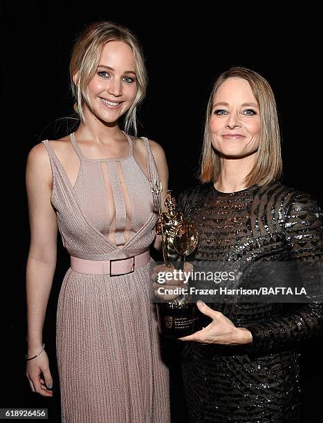 Actress Jennifer Lawrence and honoree Jodie Foster, recipient of the Stanley Kubrick Britannia Award for Excellence in Film, attend the 2016 AMD...