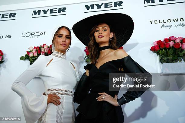 Jodi Gordon and Nicole Trunfio pose in the Myer Fashion On The Field Marquee on Victoria Derby Day at Flemington Racecourse on October 29, 2016 in...