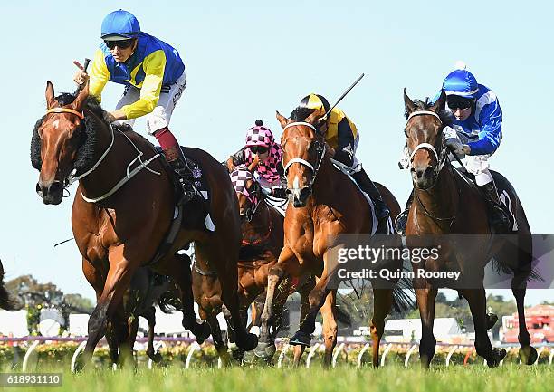 Hugh Bowman rides Le Romain to win race eight, the Cantala Stakes on Derby Day at Flemington Racecourse on October 29, 2016 in Melbourne, Australia.