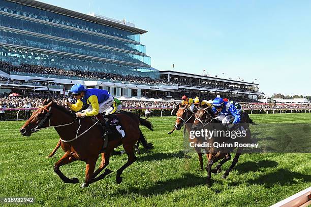 Hugh Bowman rides Le Romain to win race eight, the Cantala Stakes on Derby Day at Flemington Racecourse on October 29, 2016 in Melbourne, Australia.