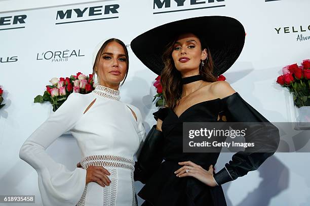 Jodi Gordon and Nicole Trunfio pose in the Myer Fashion On The Field Marquee on Victoria Derby Day at Flemington Racecourse on October 29, 2016 in...