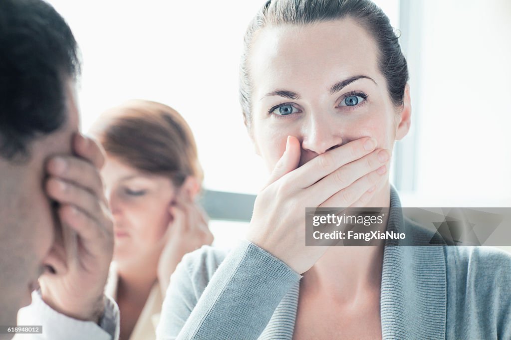 People making hear, see, speak no evil gesture