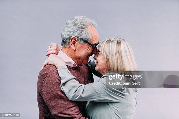 senior couple in love - couple laughing hugging stock pictures, royalty-free photos & images