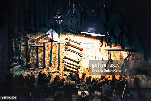 vintage tools, workshop with tool set hanging on a board - gripping tool stock pictures, royalty-free photos & images