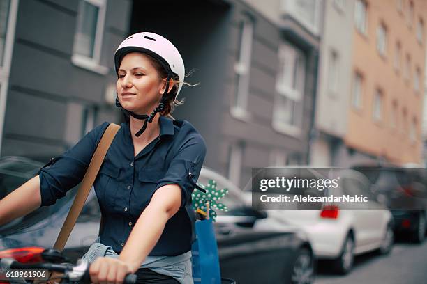 girl in motion - cycling streets stock pictures, royalty-free photos & images