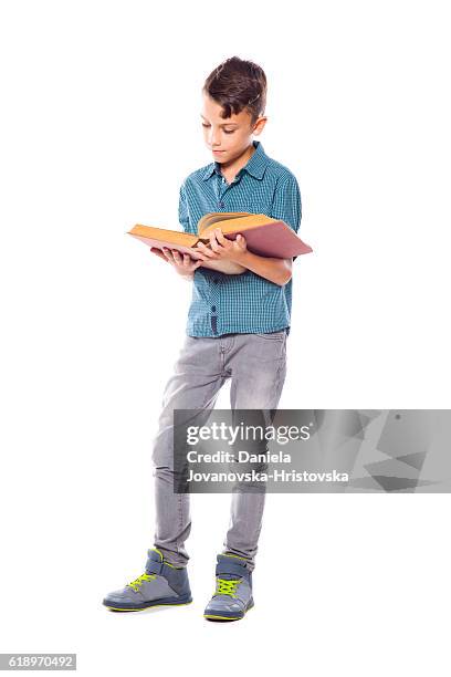 bildung  - boy reading a book stock-fotos und bilder