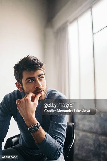 worried young man - thinking man stock pictures, royalty-free photos & images