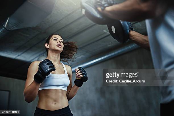 boxing her way to a knockout body - belly punching stock pictures, royalty-free photos & images
