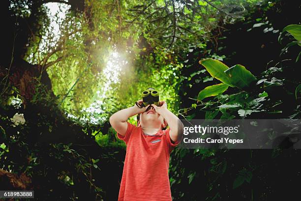 boy binoculars looking  outdoors - school holiday stock pictures, royalty-free photos & images