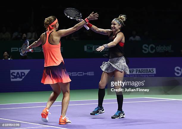 Lucie Safarova of Czech Republic and Bethanie Mattek-Sands of the United States celebrate victory in their semi-final doubles match against Caroline...