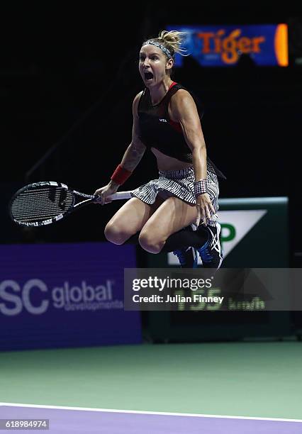 Bethanie Mattek-Sands of the United States celebrates victory partnering Lucie Safarova of Czech Republic in their semi-final doubles match against...