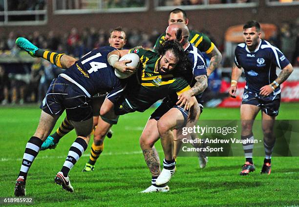 Australia's Aaron Woods is tackled by Scotland's Ben Hellewell during the Four Nations match between the Australian Kangaroos and Scotland at...