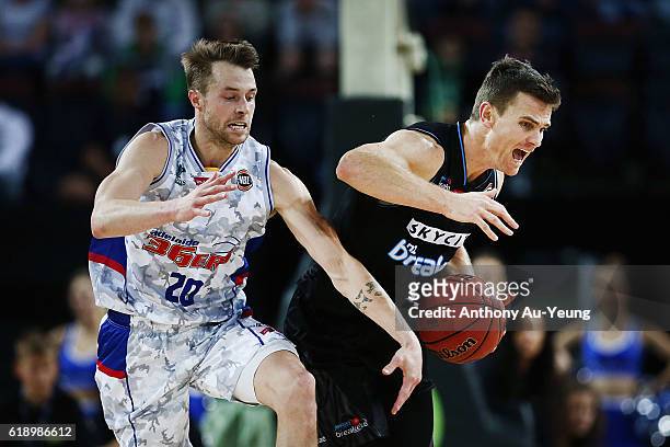 Kirk Penney of New Zealand clashes with Nathan Sobey of Adelaide during the round four NBL match between the New Zealand Breakers and the Adelaide...