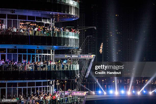 In this handout image provided by Red Bull, Andy Jones of the USA dives from the 27 metre platform on the Dubai Marina Pier 7 building during the...