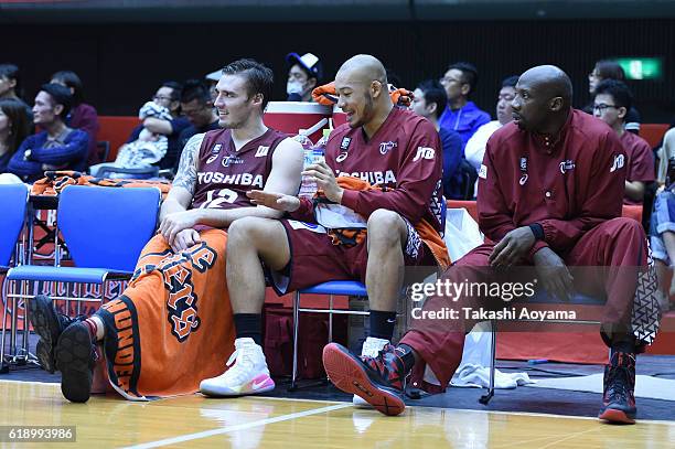 Ryan Spangler, Kevin Hareyama and Mamadou Diouf of the Kawasaki Brave Thunders looks on from the bench during the B. League match between Toshiba...