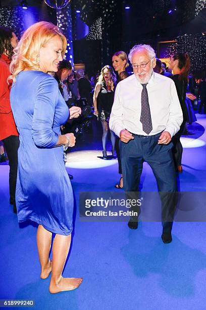 German actor Dieter Hallervorden is dancing with his girlfriend Christiane Zander during the Goldene Henne Aftershow Party on October 28, 2016 in...