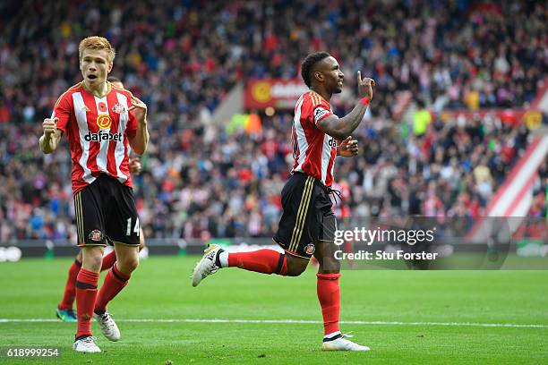 Jermain Defoe of Sunderland celebrates scoring his sides first goal during the Premier League match between Sunderland and Arsenal at the Stadium of...