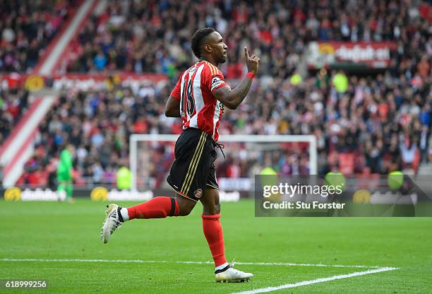 Jermain Defoe of Sunderland celebrates scoring his sides first goal during the Premier League match between Sunderland and Arsenal at the Stadium of...