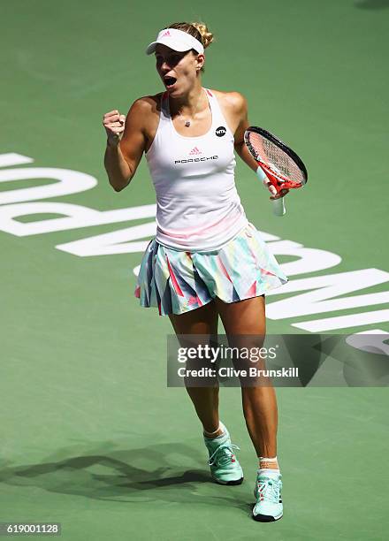 Angelique Kerber of Germany celebrates victory in her singles semi-final match against Agnieszka Radwanska of Poland during day 7 of the BNP Paribas...