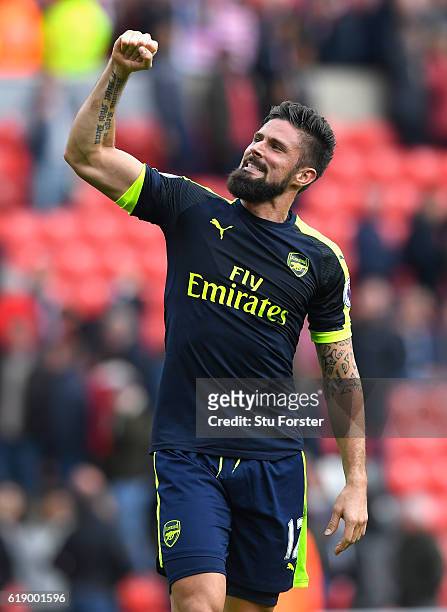 Olivier Giroud of Arsenal celebrates his team's 4-1 win in the Premier League match between Sunderland and Arsenal at the Stadium of Light on October...