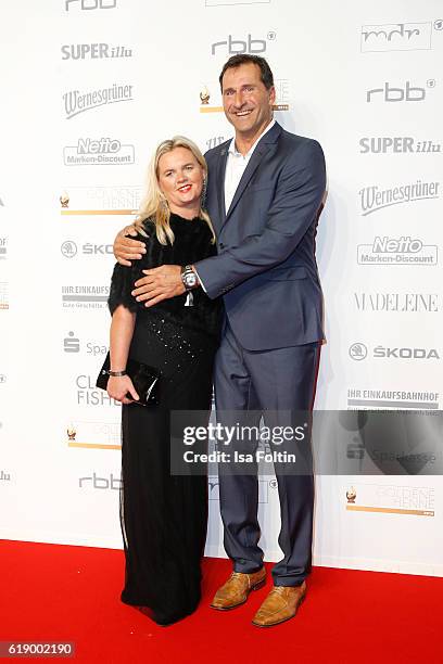 Former discus thrower Lars Riedel and his wife attend the Goldene Henne on October 28, 2016 in Leipzig, Germany.