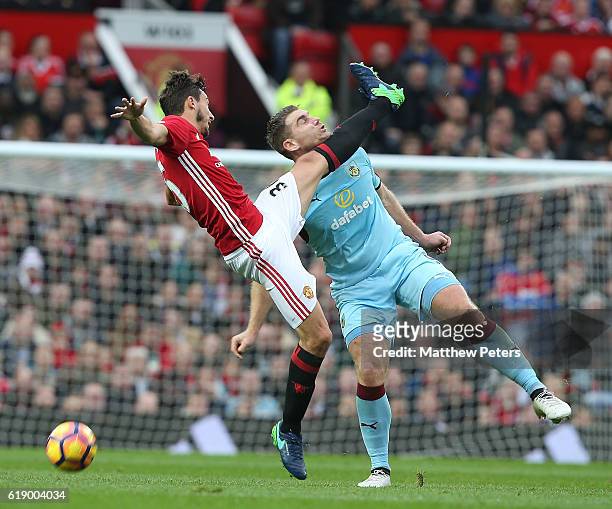 Matteo Darmian of Manchester United in action with Sam Vokes of Burnley during the Premier League match between Manchester United and Burnley at Old...