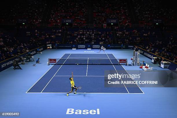 Japan's Kei Nishikori serves a ball to Luxembourg's Gilles Muller during their semi final match at the Swiss Indoors ATP 500 tennis tournament on...