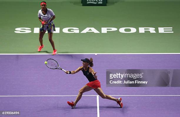 Martina Hingis of Switzerland and Sania Mirza of India in action in their doubles semi-final against Elena Vesnina and Ekaterina Makarova of Russia...