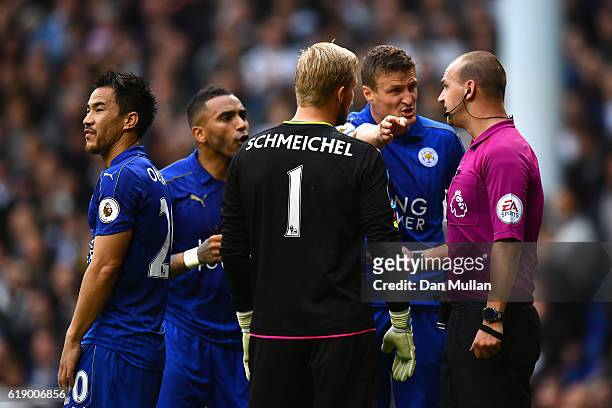 Robert Huth of Leicester City protests to referee Robert Madley against his penalty dicision during the Premier League match between Tottenham...