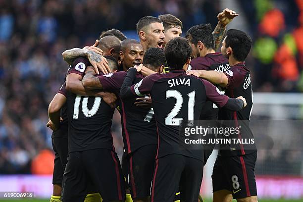 Manchester City's players celebrate after Aguero scores their second goal during the English Premier League football match between West Bromwich...