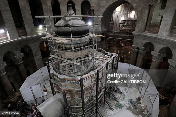 Greek preservation experts work to strengthen the Edicule surrounding the Tomb of Jesus, where his body is believed to have been laid, as part of...